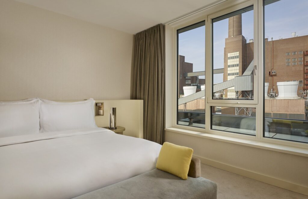 Double bed in a Superior Room at The Ritz-Carlton, Wolfsburg, with a view of the VW factory